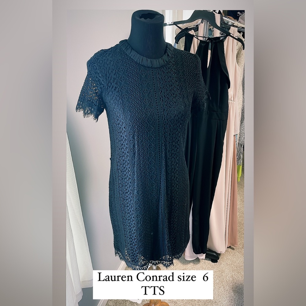 Little black dress with crochet sleeves and overlay